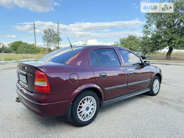 Красный Опель Астра, объемом двигателя 1.4 л и пробегом 183 тыс. км за 4200 $, фото 5 на Automoto.ua