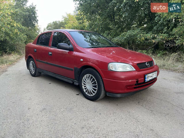 Красный Опель Астра, объемом двигателя 1.4 л и пробегом 315 тыс. км за 3000 $, фото 1 на Automoto.ua