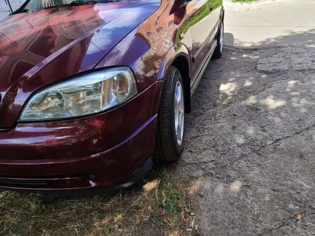Красный Опель Астра, объемом двигателя 1.4 л и пробегом 226 тыс. км за 4500 $, фото 5 на Automoto.ua