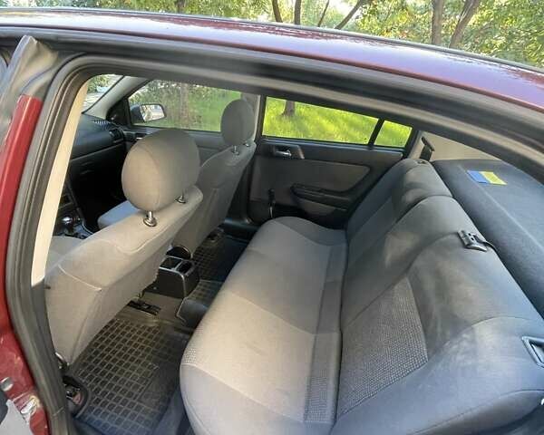 Красный Опель Астра, объемом двигателя 1.4 л и пробегом 177 тыс. км за 4600 $, фото 24 на Automoto.ua