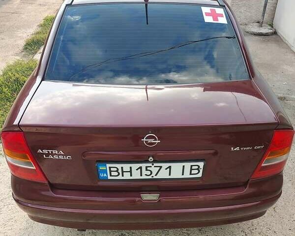 Красный Опель Астра, объемом двигателя 1.4 л и пробегом 198 тыс. км за 3000 $, фото 3 на Automoto.ua