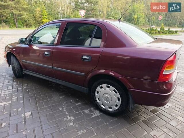 Красный Опель Астра, объемом двигателя 1.4 л и пробегом 285 тыс. км за 3100 $, фото 5 на Automoto.ua
