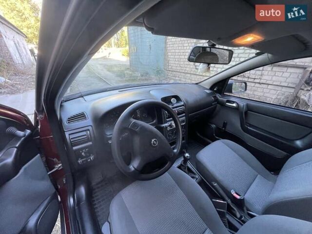 Красный Опель Астра, объемом двигателя 1.4 л и пробегом 177 тыс. км за 4600 $, фото 19 на Automoto.ua