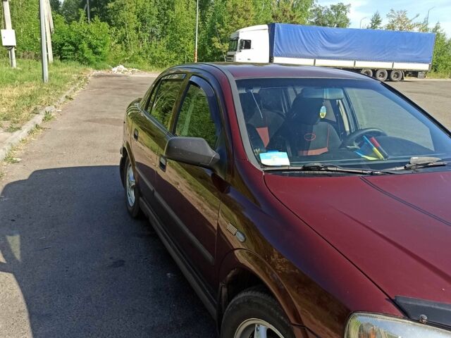 Красный Опель Астра, объемом двигателя 1.6 л и пробегом 204 тыс. км за 3000 $, фото 4 на Automoto.ua