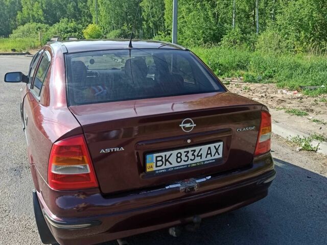 Красный Опель Астра, объемом двигателя 1.6 л и пробегом 204 тыс. км за 3000 $, фото 2 на Automoto.ua