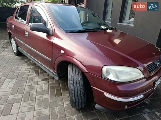 Красный Опель Астра, объемом двигателя 1.4 л и пробегом 285 тыс. км за 3100 $, фото 3 на Automoto.ua