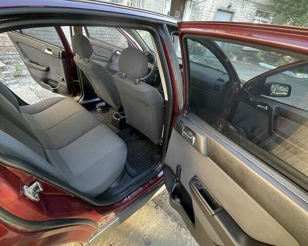 Красный Опель Астра, объемом двигателя 1.4 л и пробегом 177 тыс. км за 4600 $, фото 27 на Automoto.ua