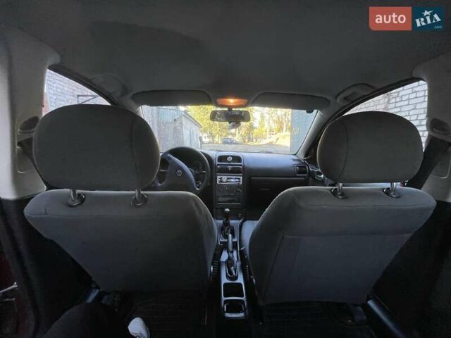 Красный Опель Астра, объемом двигателя 1.4 л и пробегом 177 тыс. км за 4600 $, фото 33 на Automoto.ua