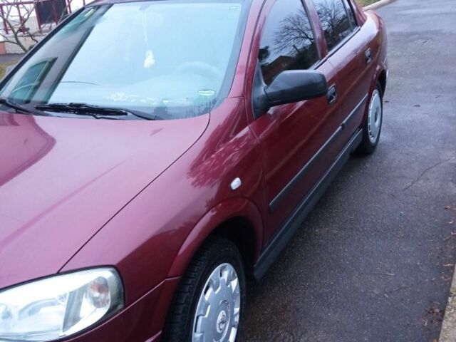 Красный Опель Астра, объемом двигателя 1.4 л и пробегом 160 тыс. км за 3500 $, фото 4 на Automoto.ua