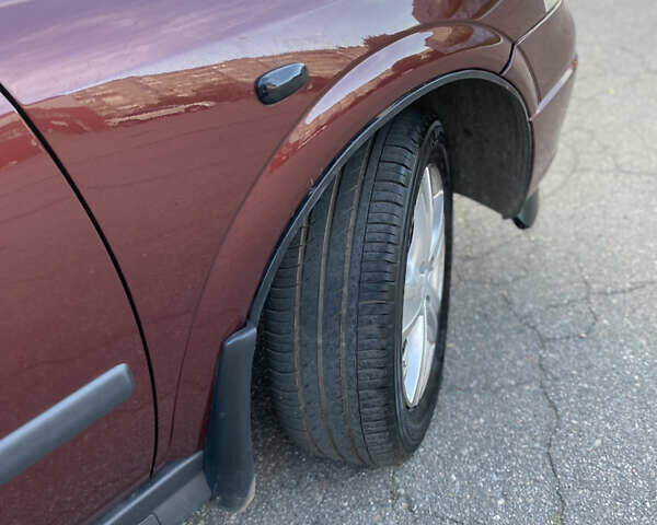 Красный Опель Астра, объемом двигателя 1.36 л и пробегом 173 тыс. км за 4800 $, фото 14 на Automoto.ua