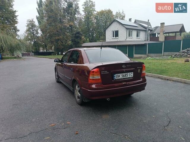 Красный Опель Астра, объемом двигателя 1.6 л и пробегом 234 тыс. км за 3800 $, фото 8 на Automoto.ua