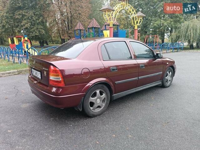 Красный Опель Астра, объемом двигателя 1.6 л и пробегом 234 тыс. км за 3800 $, фото 6 на Automoto.ua