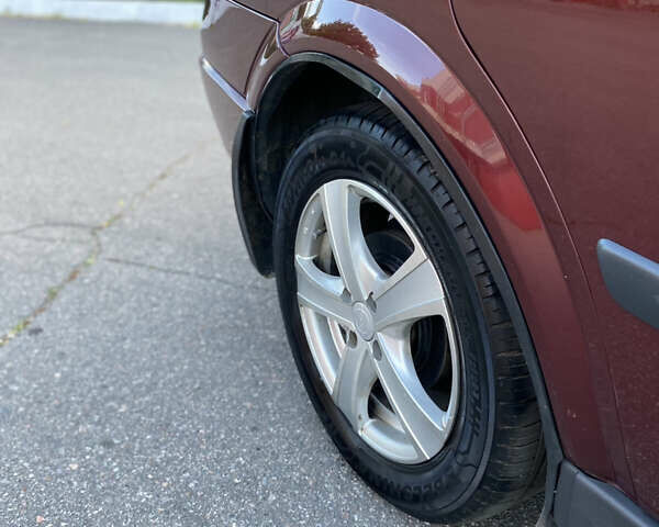 Красный Опель Астра, объемом двигателя 1.36 л и пробегом 173 тыс. км за 4800 $, фото 15 на Automoto.ua