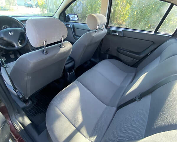 Красный Опель Астра, объемом двигателя 1.6 л и пробегом 233 тыс. км за 3300 $, фото 13 на Automoto.ua