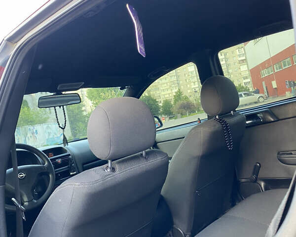 Красный Опель Астра, объемом двигателя 1.36 л и пробегом 173 тыс. км за 4800 $, фото 9 на Automoto.ua