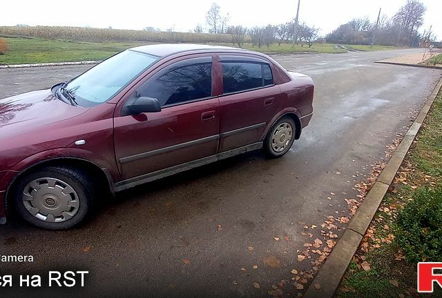 Красный Опель Астра, объемом двигателя 1.4 л и пробегом 100 тыс. км за 3100 $, фото 1 на Automoto.ua
