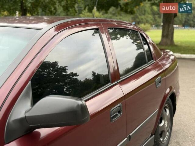 Червоний Опель Астра, об'ємом двигуна 1.6 л та пробігом 233 тис. км за 3400 $, фото 5 на Automoto.ua