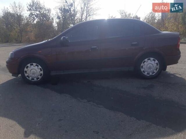 Красный Опель Астра, объемом двигателя 1.4 л и пробегом 320 тыс. км за 3450 $, фото 2 на Automoto.ua