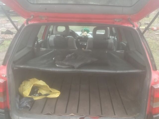 Красный Опель Астра, объемом двигателя 1.6 л и пробегом 400 тыс. км за 650 $, фото 6 на Automoto.ua