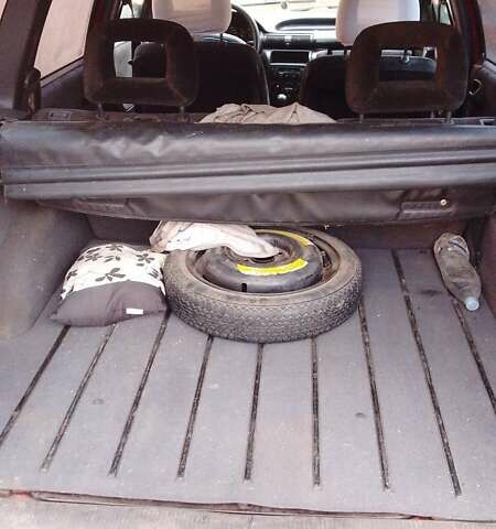 Червоний Опель Астра, об'ємом двигуна 1.8 л та пробігом 431 тис. км за 2000 $, фото 4 на Automoto.ua