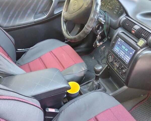 Красный Опель Астра, объемом двигателя 1.7 л и пробегом 260 тыс. км за 2650 $, фото 3 на Automoto.ua
