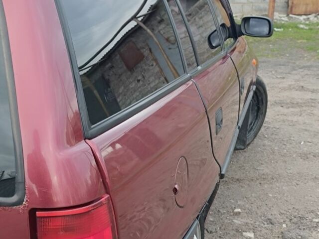 Красный Опель Астра, объемом двигателя 1.6 л и пробегом 400 тыс. км за 2000 $, фото 1 на Automoto.ua