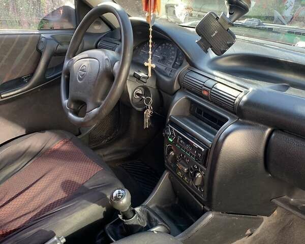 Красный Опель Астра, объемом двигателя 1.6 л и пробегом 391 тыс. км за 2700 $, фото 3 на Automoto.ua