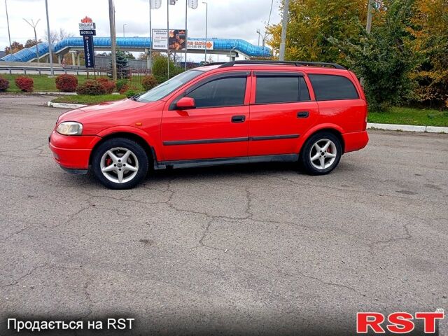 Красный Опель Астра, объемом двигателя 1.6 л и пробегом 300 тыс. км за 2550 $, фото 4 на Automoto.ua