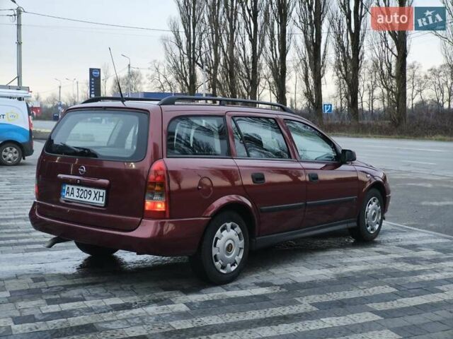 Красный Опель Астра, объемом двигателя 2 л и пробегом 281 тыс. км за 2999 $, фото 3 на Automoto.ua