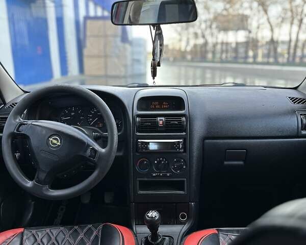 Красный Опель Астра, объемом двигателя 2 л и пробегом 250 тыс. км за 2699 $, фото 9 на Automoto.ua