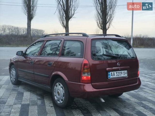 Красный Опель Астра, объемом двигателя 2 л и пробегом 281 тыс. км за 2999 $, фото 4 на Automoto.ua