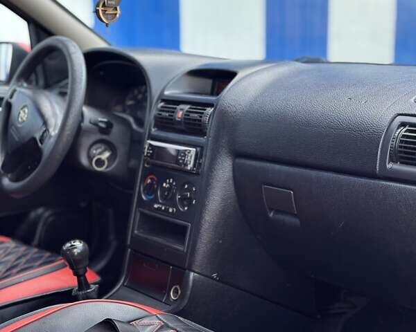 Красный Опель Астра, объемом двигателя 2 л и пробегом 250 тыс. км за 2699 $, фото 8 на Automoto.ua