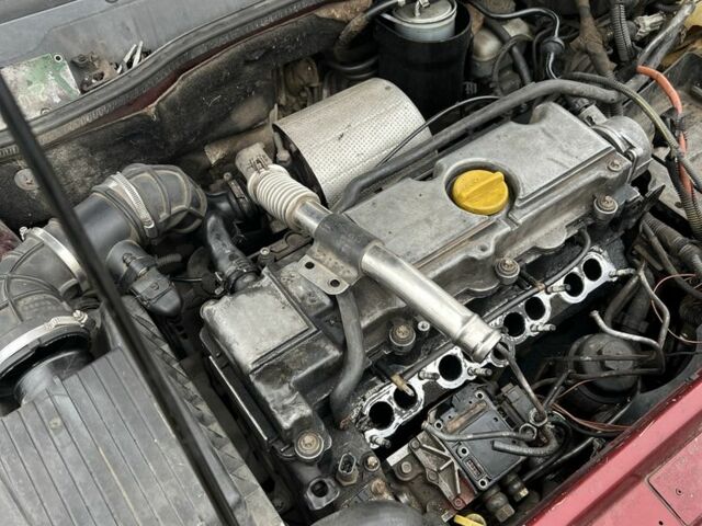 Красный Опель Астра, объемом двигателя 2 л и пробегом 80 тыс. км за 550 $, фото 5 на Automoto.ua