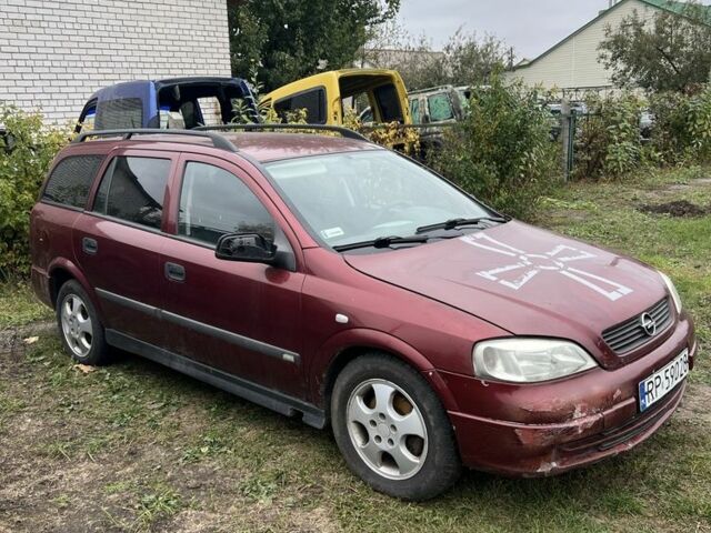 Красный Опель Астра, объемом двигателя 2 л и пробегом 200 тыс. км за 650 $, фото 1 на Automoto.ua