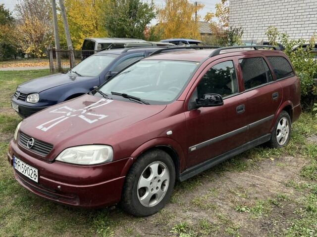 Красный Опель Астра, объемом двигателя 2 л и пробегом 200 тыс. км за 650 $, фото 2 на Automoto.ua