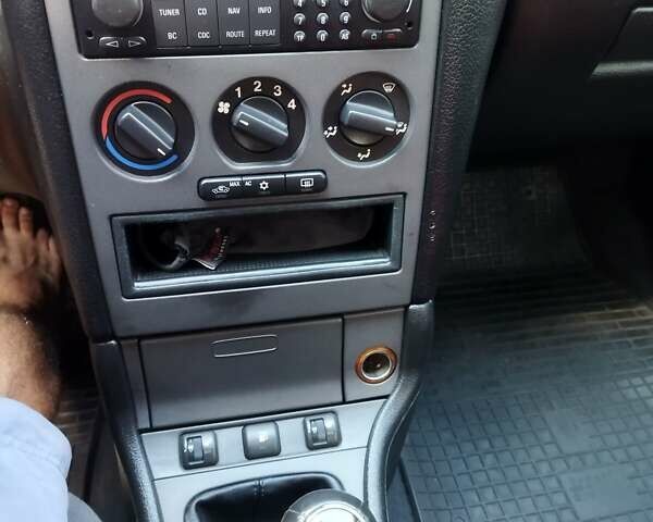 Красный Опель Астра, объемом двигателя 1.6 л и пробегом 398 тыс. км за 3500 $, фото 13 на Automoto.ua