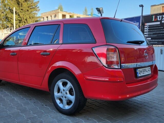 Красный Опель Астра, объемом двигателя 1.4 л и пробегом 217 тыс. км за 4950 $, фото 2 на Automoto.ua