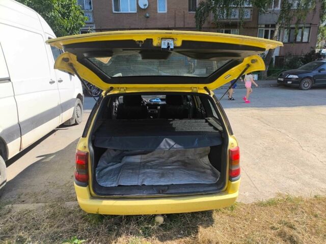 Желтый Опель Астра, объемом двигателя 1.8 л и пробегом 300 тыс. км за 1400 $, фото 9 на Automoto.ua