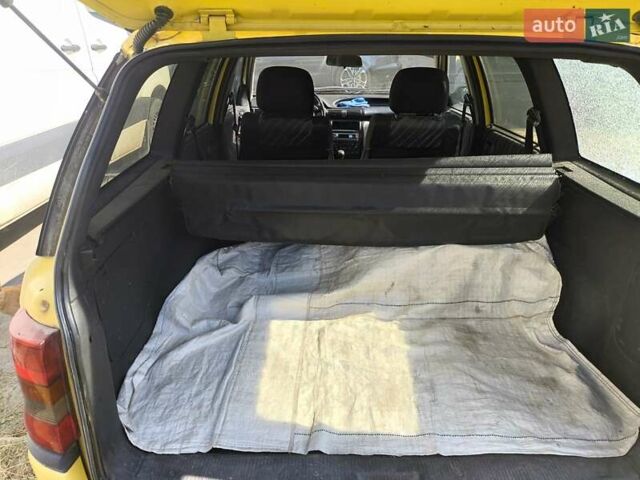 Желтый Опель Астра, объемом двигателя 1.8 л и пробегом 300 тыс. км за 1100 $, фото 13 на Automoto.ua