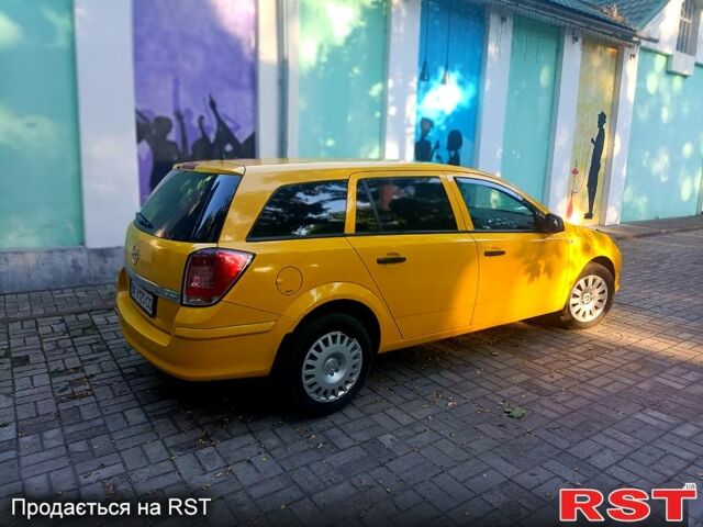 Желтый Опель Астра, объемом двигателя 1.7 л и пробегом 315 тыс. км за 5000 $, фото 3 на Automoto.ua