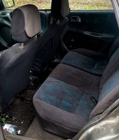 Серый Опель Астра, объемом двигателя 1.4 л и пробегом 280 тыс. км за 1350 $, фото 6 на Automoto.ua