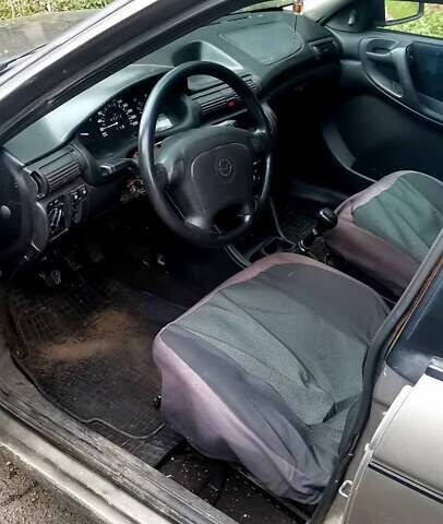 Серый Опель Астра, объемом двигателя 1.4 л и пробегом 280 тыс. км за 1350 $, фото 5 на Automoto.ua