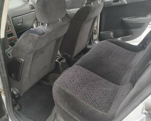 Серый Опель Астра, объемом двигателя 2 л и пробегом 374 тыс. км за 2550 $, фото 11 на Automoto.ua