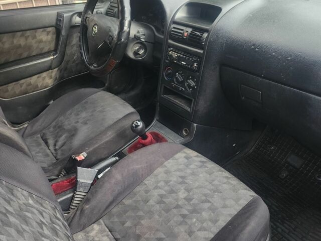 Серый Опель Астра, объемом двигателя 2 л и пробегом 300 тыс. км за 980 $, фото 7 на Automoto.ua