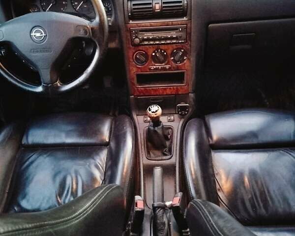 Серый Опель Астра, объемом двигателя 1.6 л и пробегом 268 тыс. км за 3800 $, фото 6 на Automoto.ua