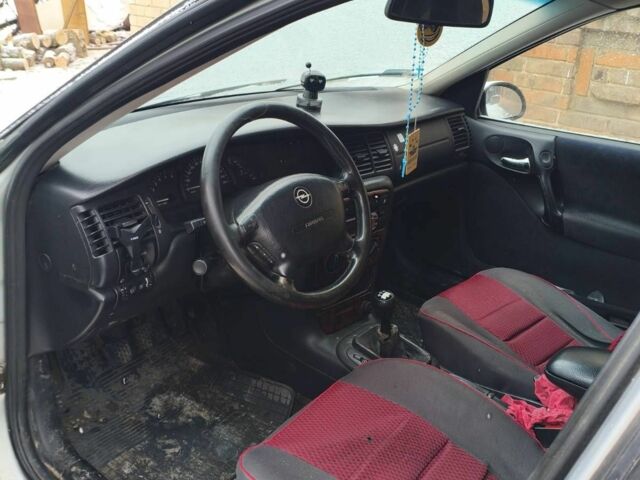 Серый Опель Астра, объемом двигателя 2 л и пробегом 250 тыс. км за 1432 $, фото 3 на Automoto.ua