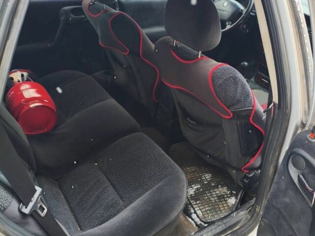 Серый Опель Астра, объемом двигателя 2 л и пробегом 250 тыс. км за 1432 $, фото 1 на Automoto.ua