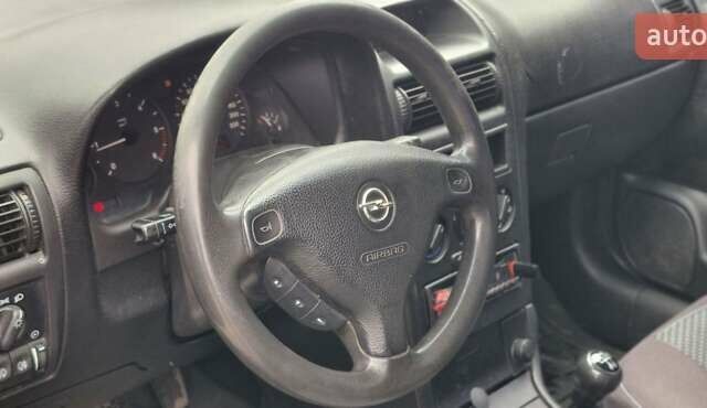 Серый Опель Астра, объемом двигателя 1.7 л и пробегом 170 тыс. км за 1900 $, фото 12 на Automoto.ua