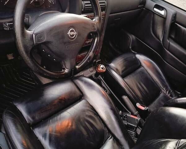 Серый Опель Астра, объемом двигателя 1.6 л и пробегом 268 тыс. км за 3800 $, фото 8 на Automoto.ua