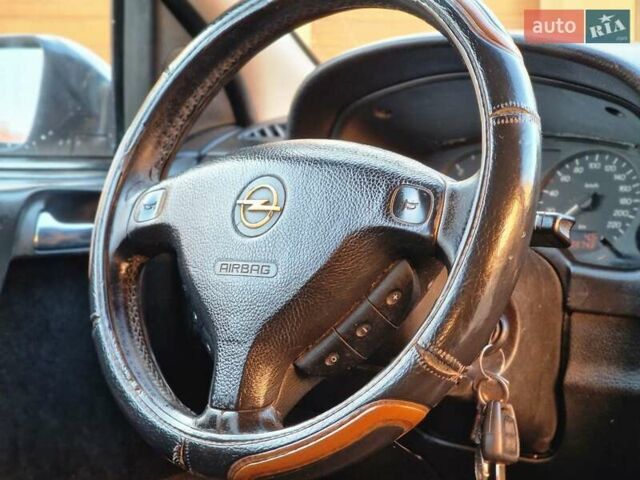 Серый Опель Астра, объемом двигателя 2 л и пробегом 398 тыс. км за 2250 $, фото 9 на Automoto.ua